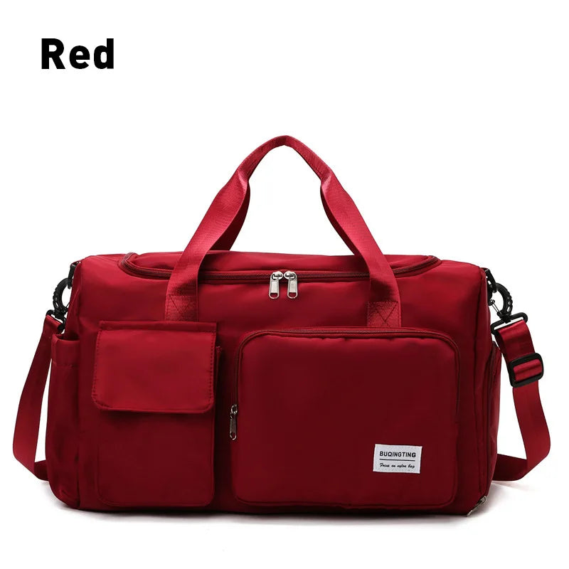 A red waterproof travel duffle bag with a separate shoe compartment.