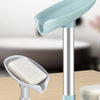 A silver soap dish with a light blue leaf-shaped suction cup holder and a white bar of soap.