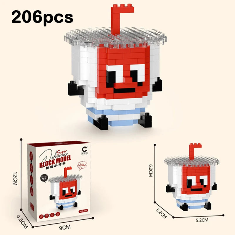 A red and white figurine made of building blocks shaped like a dessert with a straw, shown next to its packaging.