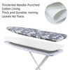 A gray and white patterned linen ironing board cover with a white pad is shown on an ironing board.