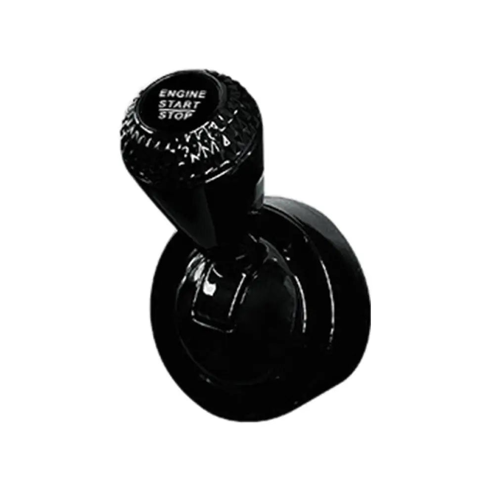 Black aluminum engine start button cover with a diamond pattern.