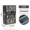 A dark wooden book safe with a combination lock and a keypad showing the word LOVE