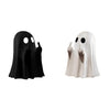 A resin statue of a ghost with a black hood and a white version with a white hood.