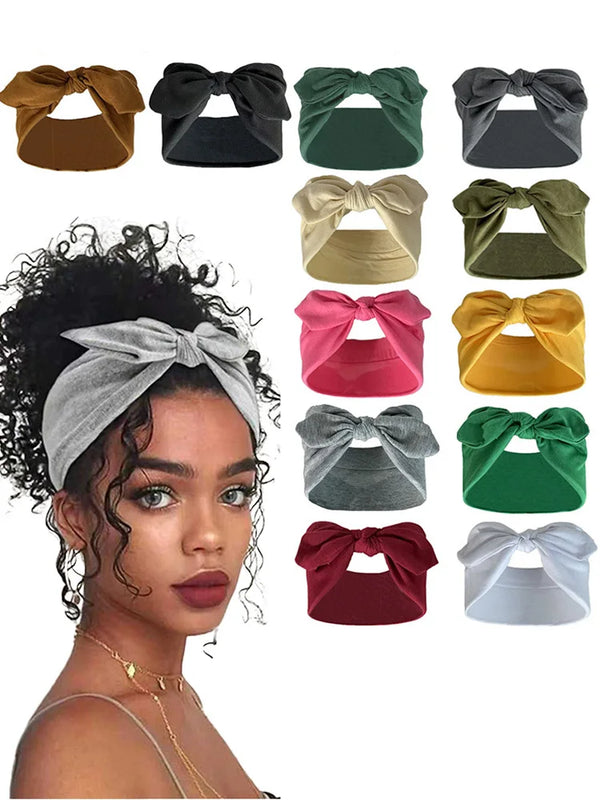 Eine Kollektion von Strick-Bow-Headbands in verschiedenen Farben wie Braun, Schwarz, Grün, Beige, Gelb, Pink und Grau.
