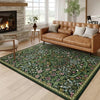 A vintage floral area rug featuring green, pink, and white botanical patterns in a living room setting.