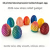 A collection of 3D printed twisted dragon eggs in various colors including blue, orange, yellow, and purple.