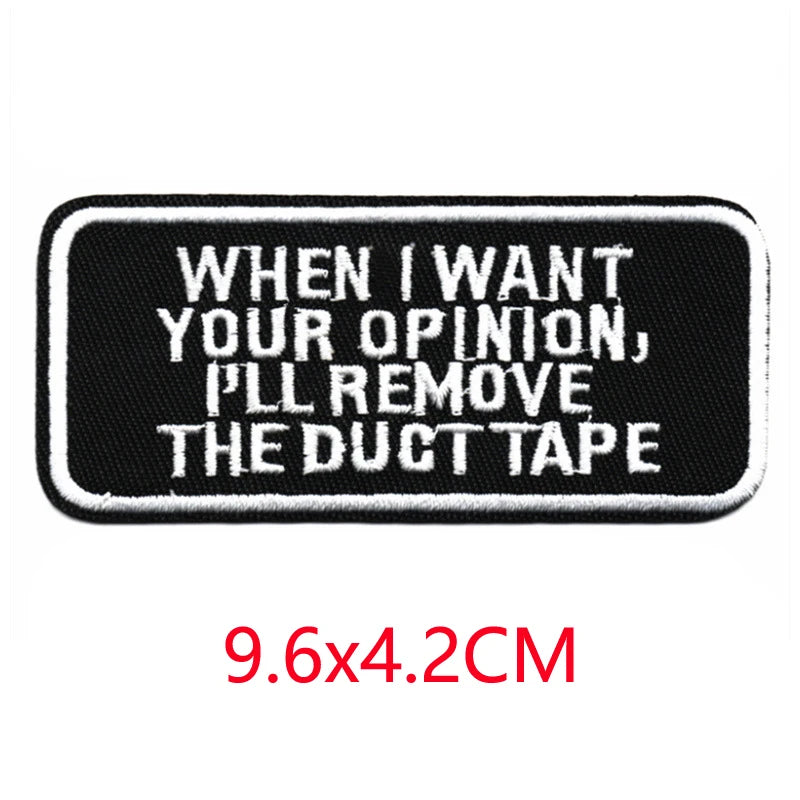 Black embroidered iron-on letter patch with white text that reads When I want your opinion I'll remove the duct tape