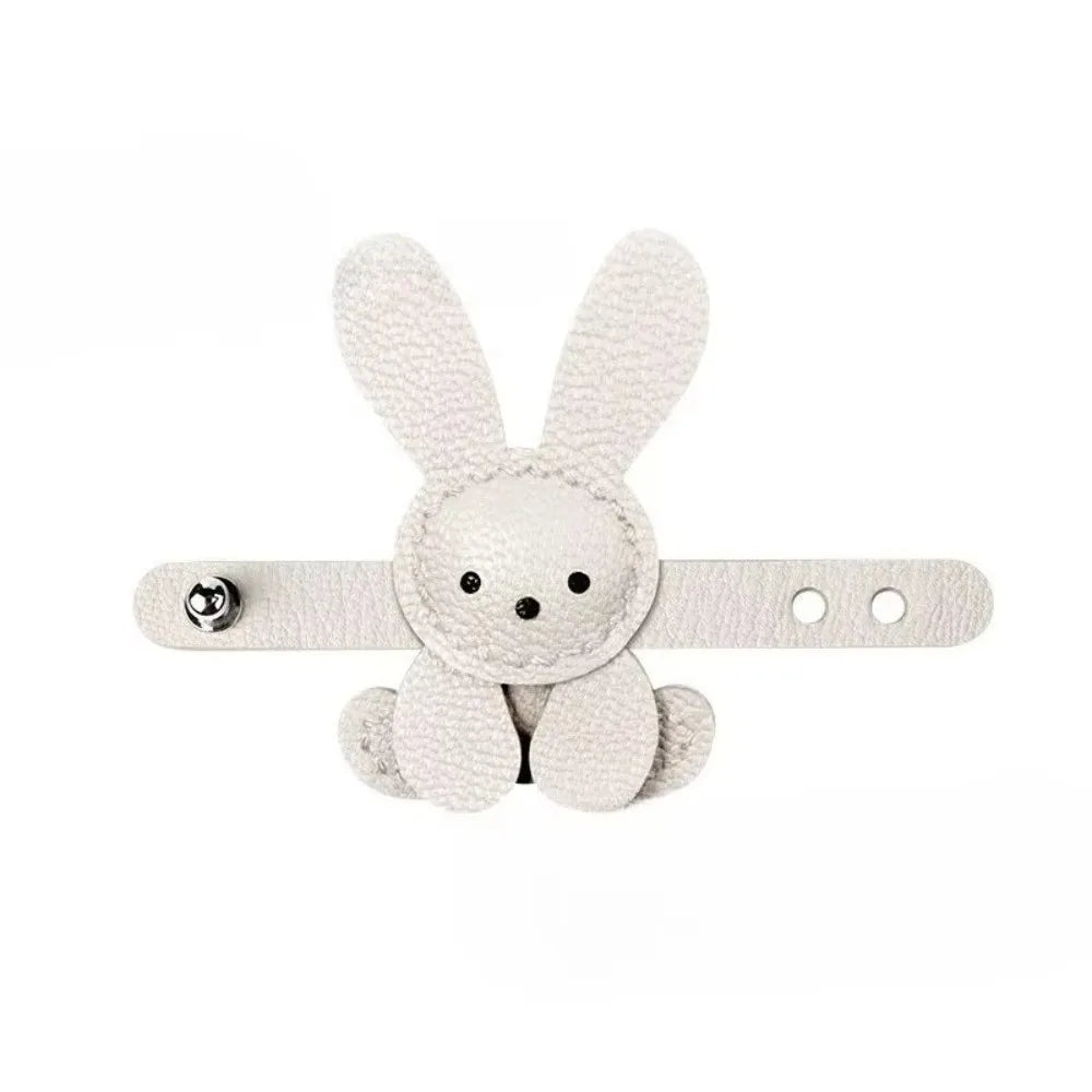 A white bunny bag charm keychain with long ears and a small body.