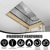 A close-up view of an attic stairway insulation cover with a silver foil barrier and wooden framing.