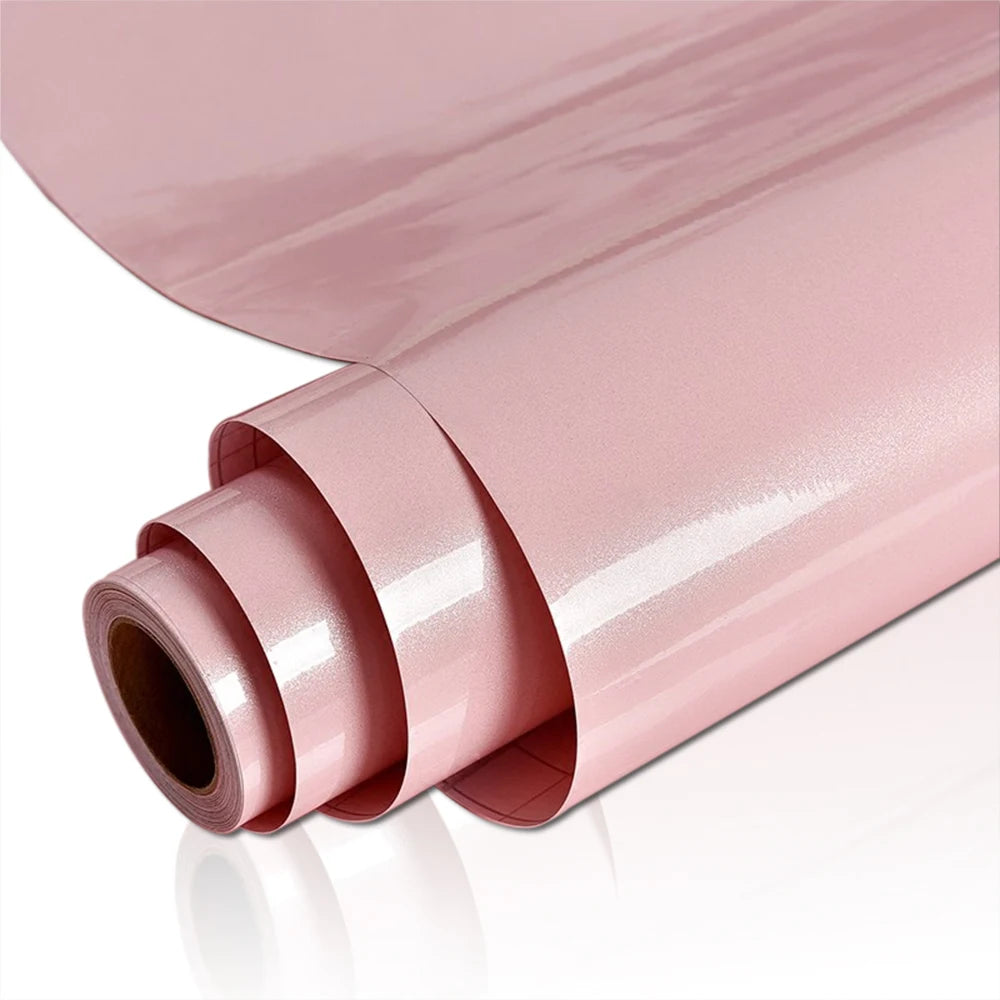 Roll of pink marble wallpaper showing the rolled and unrolled texture