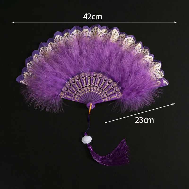 Purple lace folding hand fan with a durable handle and decorative fringe