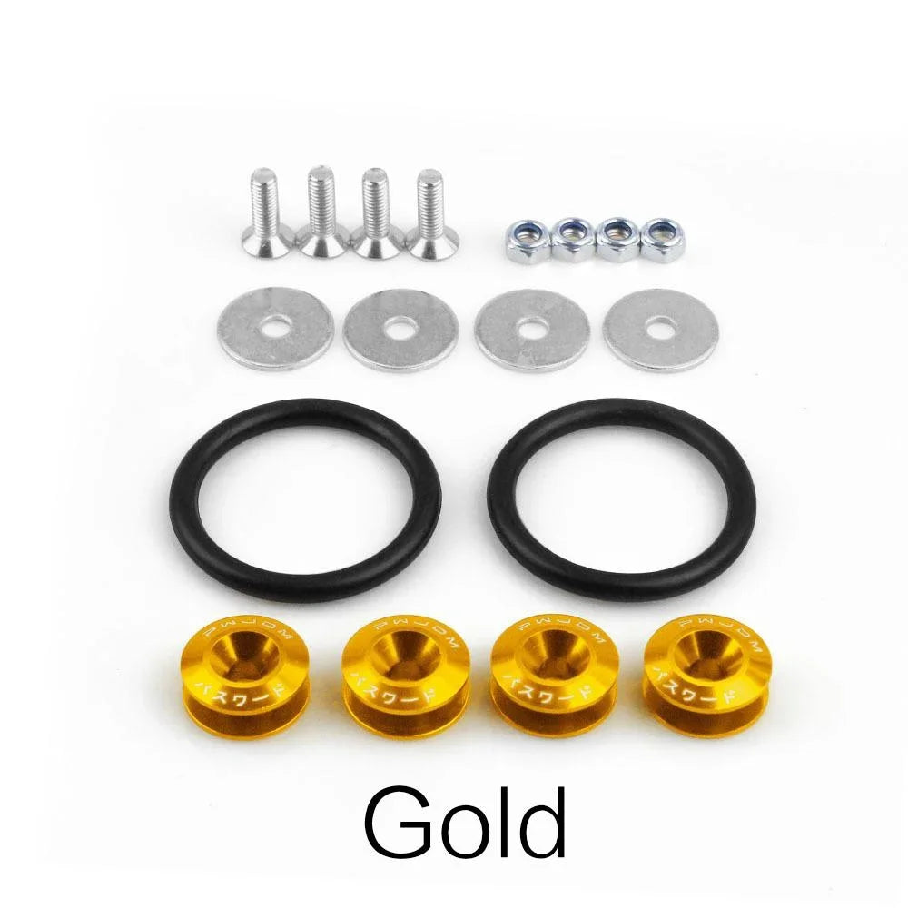 A set of gold quick release bumper fasteners and black rings for car body panels