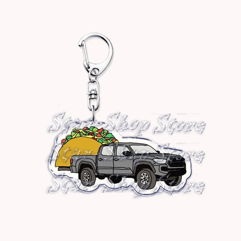 A silver metal key ring attached to a durable keychain featuring an off-road truck design.