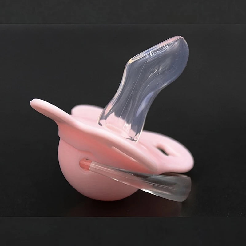 A pink silicone baby pacifier with a flower design and a clear protective cover.