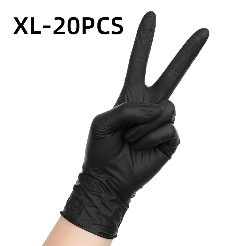 A hand wearing black disposable nitrile gloves making a peace sign.