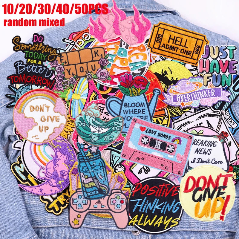 A collection of embroidered patches featuring positive and encouraging phrases like Hell admit one just have fun don't give u