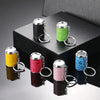 A collection of metal coin tube keychains in various colors, including yellow, pink, blue, and silver, displayed on a dark bo