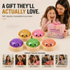 A box of glitter squishy mystery toys with various colored and themed fidget toys for gifts