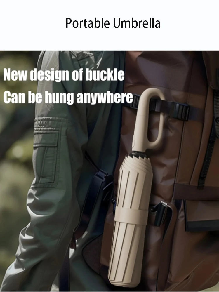 A close-up of a beige umbrella handle being hung on a brown leather jacket.
