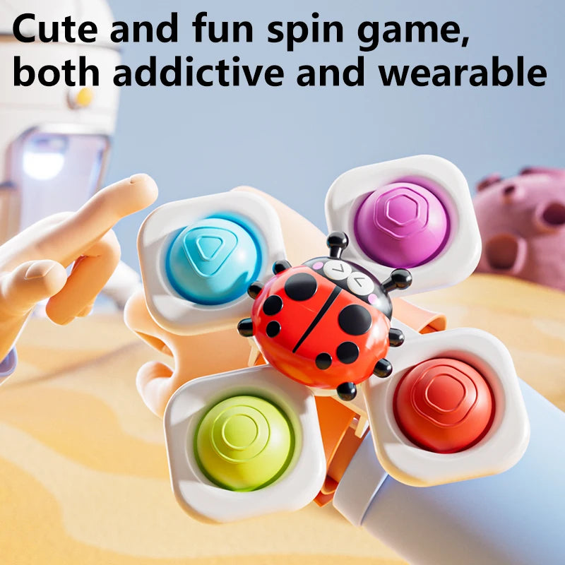 A close-up of three colorful spinning top fidget toys with watch bands being spun by a hand.
