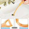 An orange flexible drain cleaning tool is shown being used in a white sink, highlighting its handle design and super flexibil