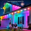 Permanent outdoor lights illuminating a house facade with vibrant colored lighting for a summer party.