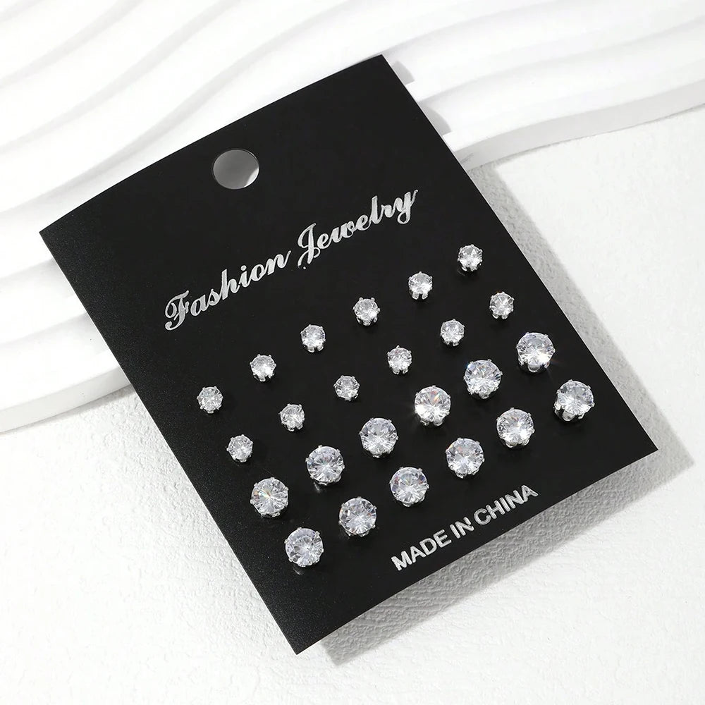 A black tag displaying a set of classic cubic zirconia stud earrings, marked as made in China.