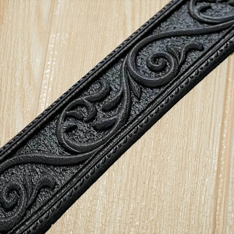Black embossed decorative trim or molding for wall panels