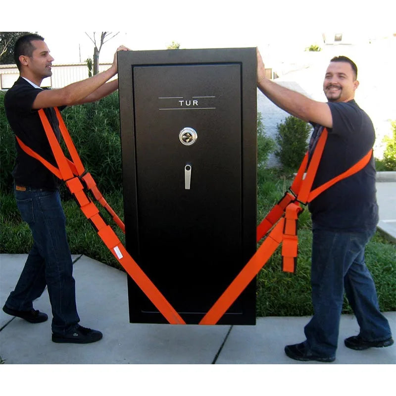 Two men using orange furniture moving straps to lift a black door with the text TUR.