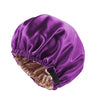 A purple satin sleep bonnet with a gathered elastic band and a black tie.