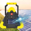 A yellow and black solar emergency triangle warning light with a built-in flashlight is placed on a solar panel.