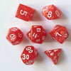 A set of seven red dice, including a five-sided die, eight-sided die, and ten-sided die, arranged on a white surface.