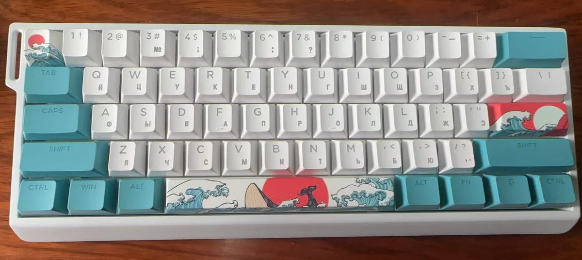 A compact 60% aluminum mechanical keyboard with custom art keycaps featuring a red and white design.