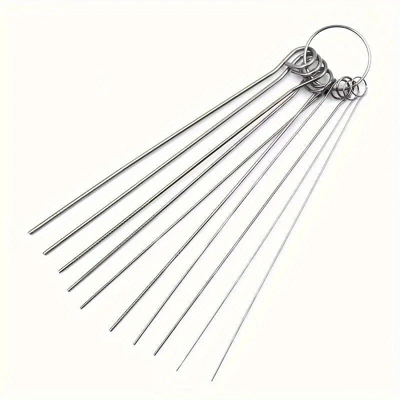 A set of ten stainless steel shower head cleaning brushes with flexible wires and a circular hook.