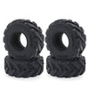 A pair of black rubber mud terrain tires for Axial SCX24 and TRX4M
