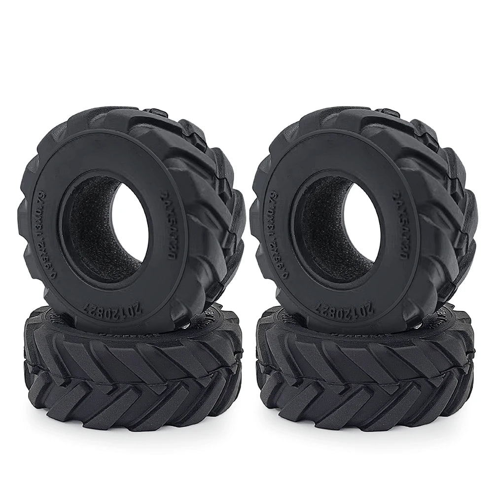 A pair of black rubber mud terrain tires for Axial SCX24 and TRX4M