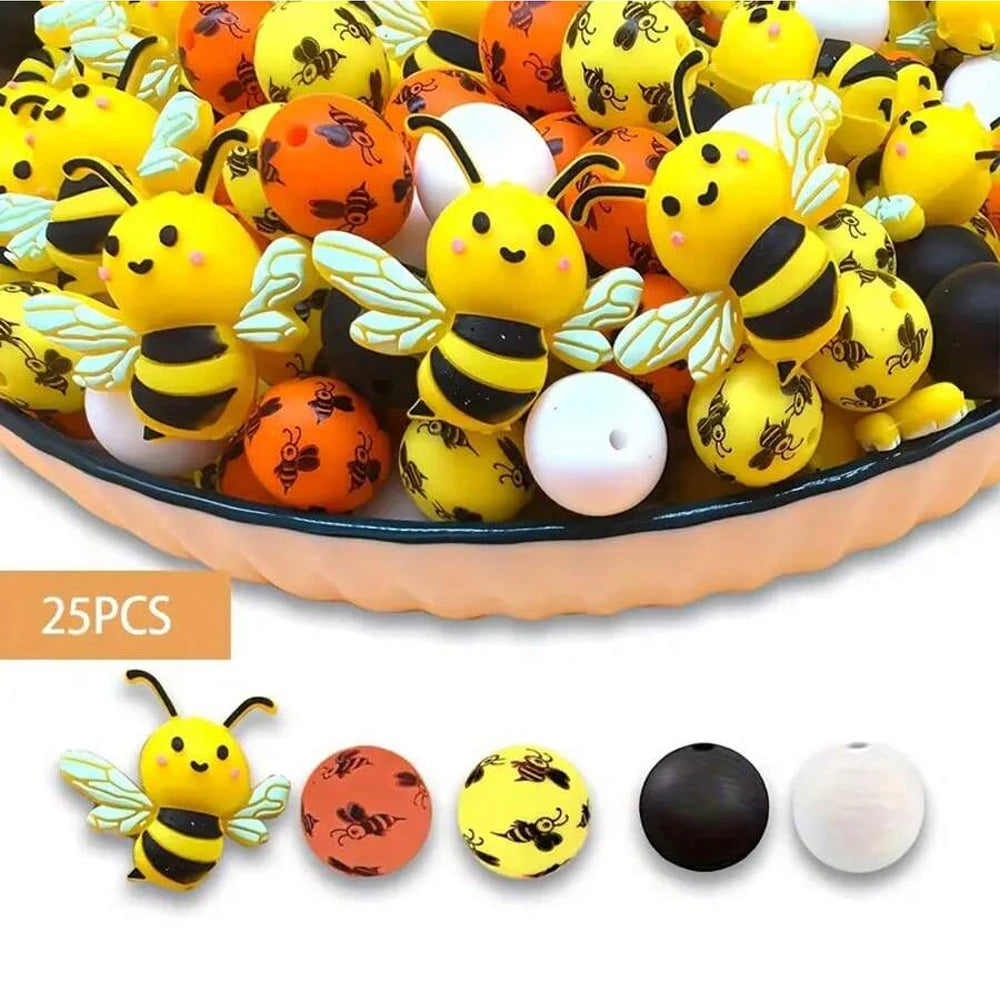 A bowl filled with colorful 3D bee silicone beads in yellow, orange, and white for jewelry making and DIY crafts