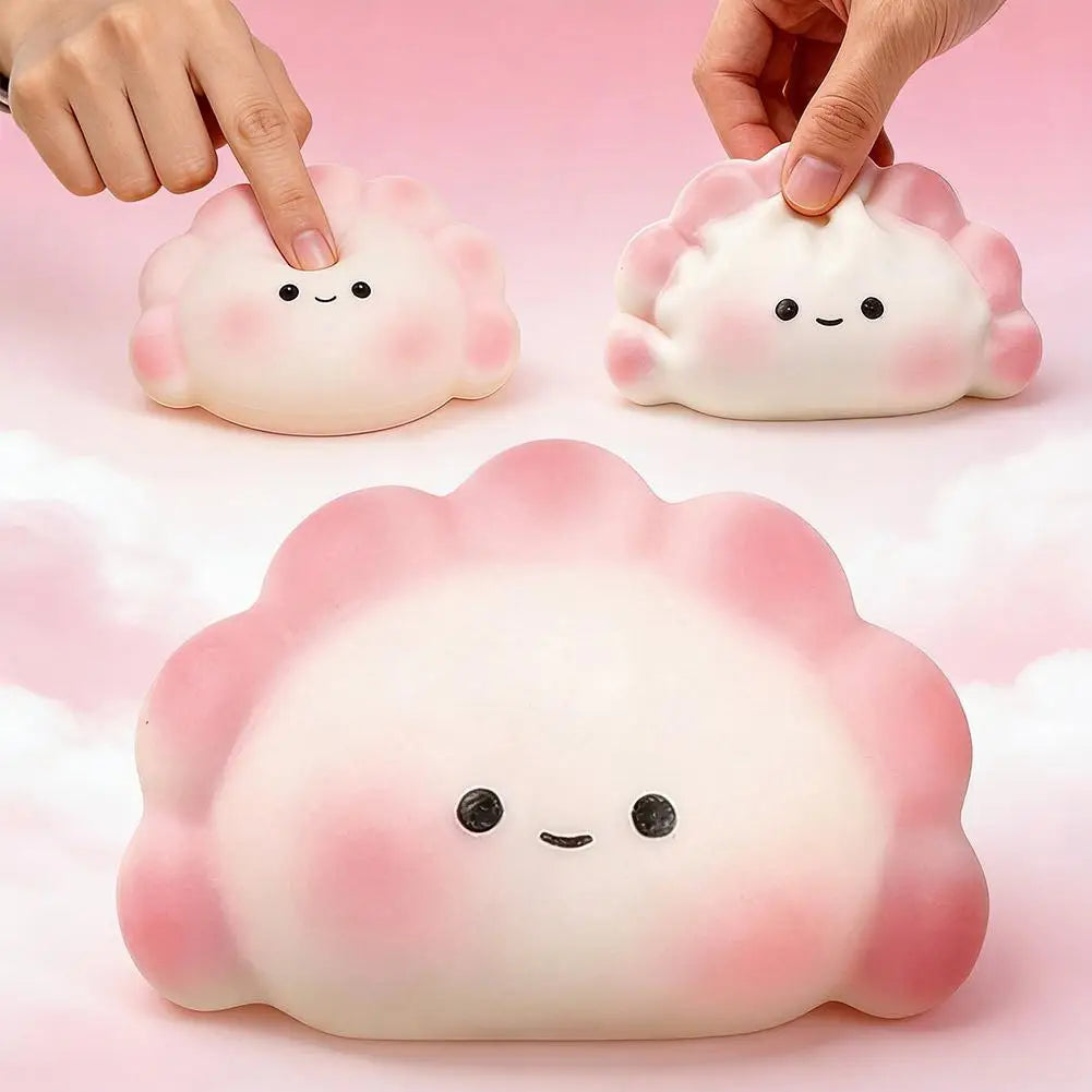 Pink squishy stress relief toy shaped like a cute dumpling with smiling eyes