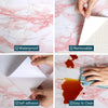 Demonstration of self-adhesive pink marble wallpaper for waterproof, removable, and easy-to-clean application.