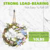 A wreath of flowers and greenery hanging from a strong load-bearing wall hook, rated for a maximum capacity of 10 lbs.