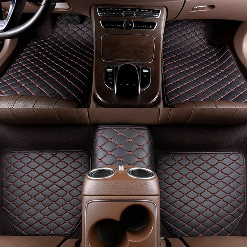 Interior view of a car showing premium PU leather floor mats and seat covers with red stitching.
