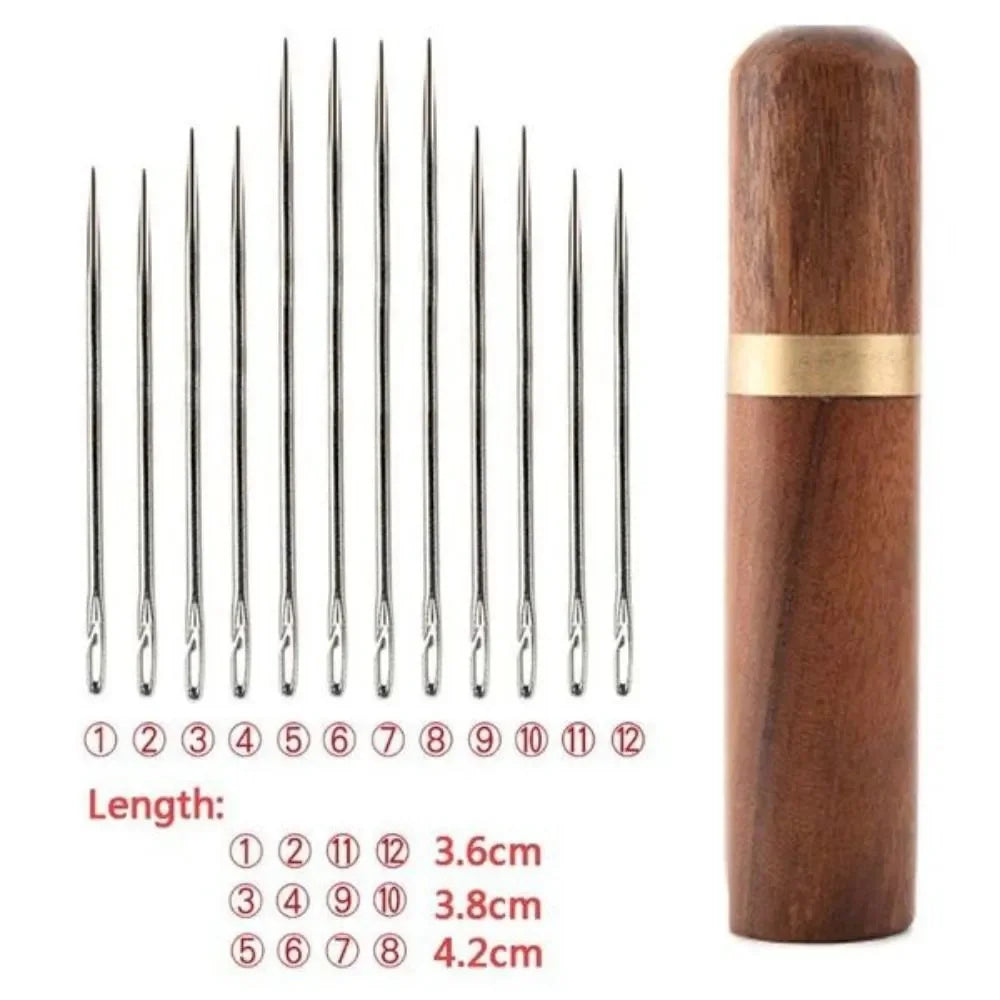 A wooden storage case containing twelve self-threading sewing needles, with a length guide showing various needle sizes.