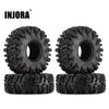 A pair of black INJORA Swamp Claw 1.0 mud terrain tires for RC crawlers.