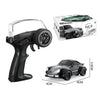 A black RC drift car and its accessories are shown next to its packaging box.