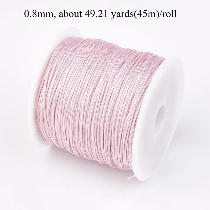 Roll of 0.8mm pink nylon cord for jewelry making and crafting