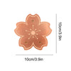 A copper bird bath cleaner disk with a floral design and triple-point support, measuring 10cm by 3.9in.