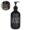 Black refillable soap dispenser bottle with the word HANDS printed on it.