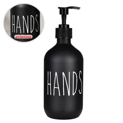 Black refillable soap dispenser bottle with the word HANDS printed on it.