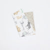 A folded soft cotton baby pillowcase featuring a cartoon animal design on a white background.