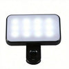 A portable rechargeable clip-on LED selfie light with three color modes, shown illuminating a white surface.